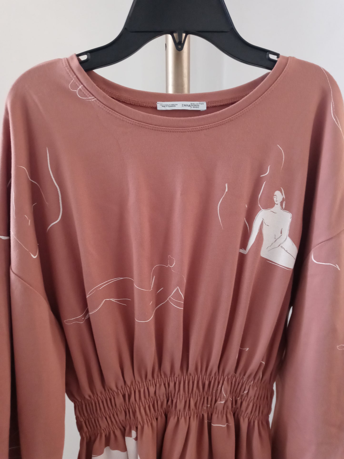 Zara dusty pink long sleeve dress with abstract line drawing of female