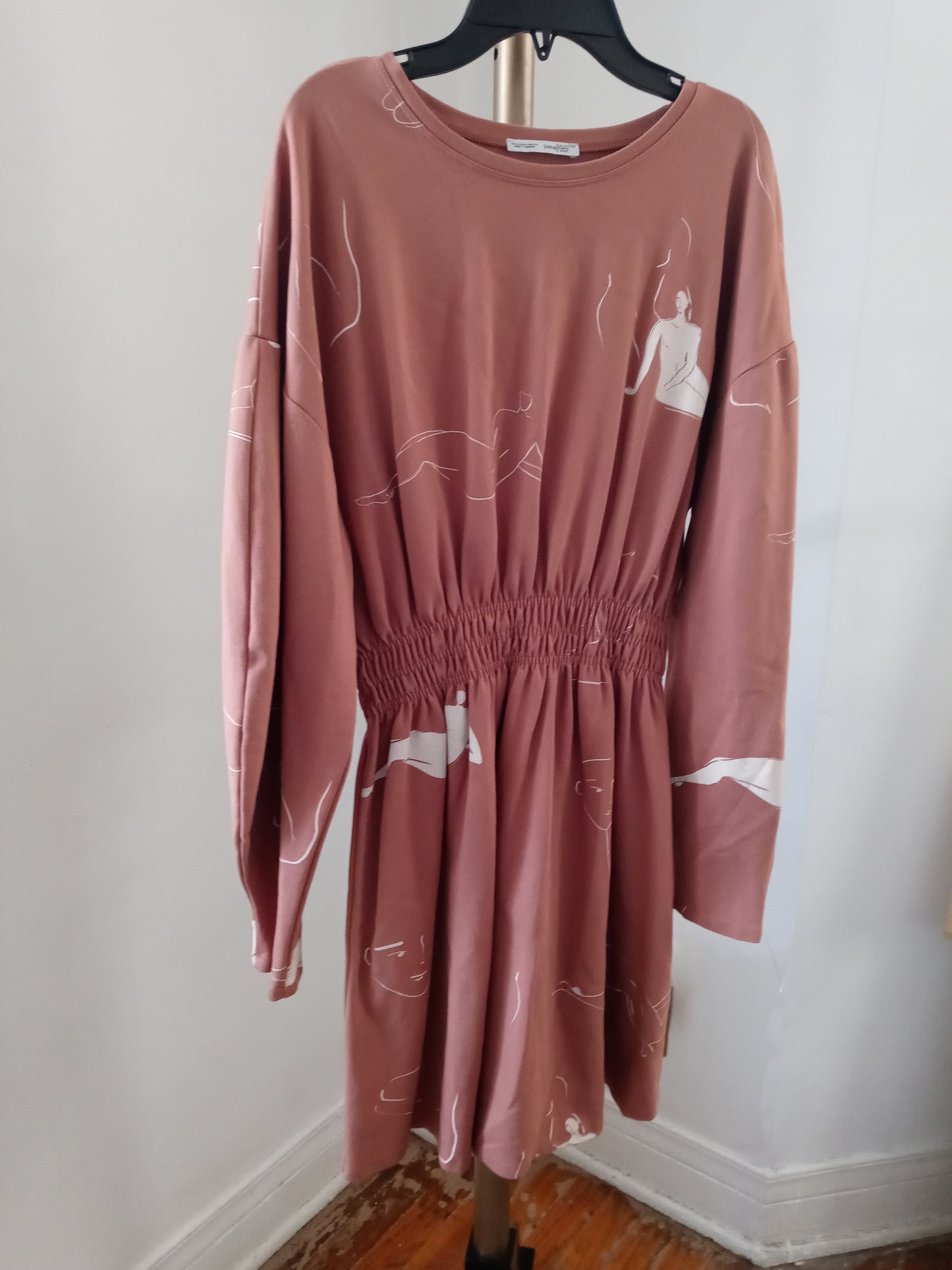 Zara dusty pink long sleeve dress with abstract line drawing of female