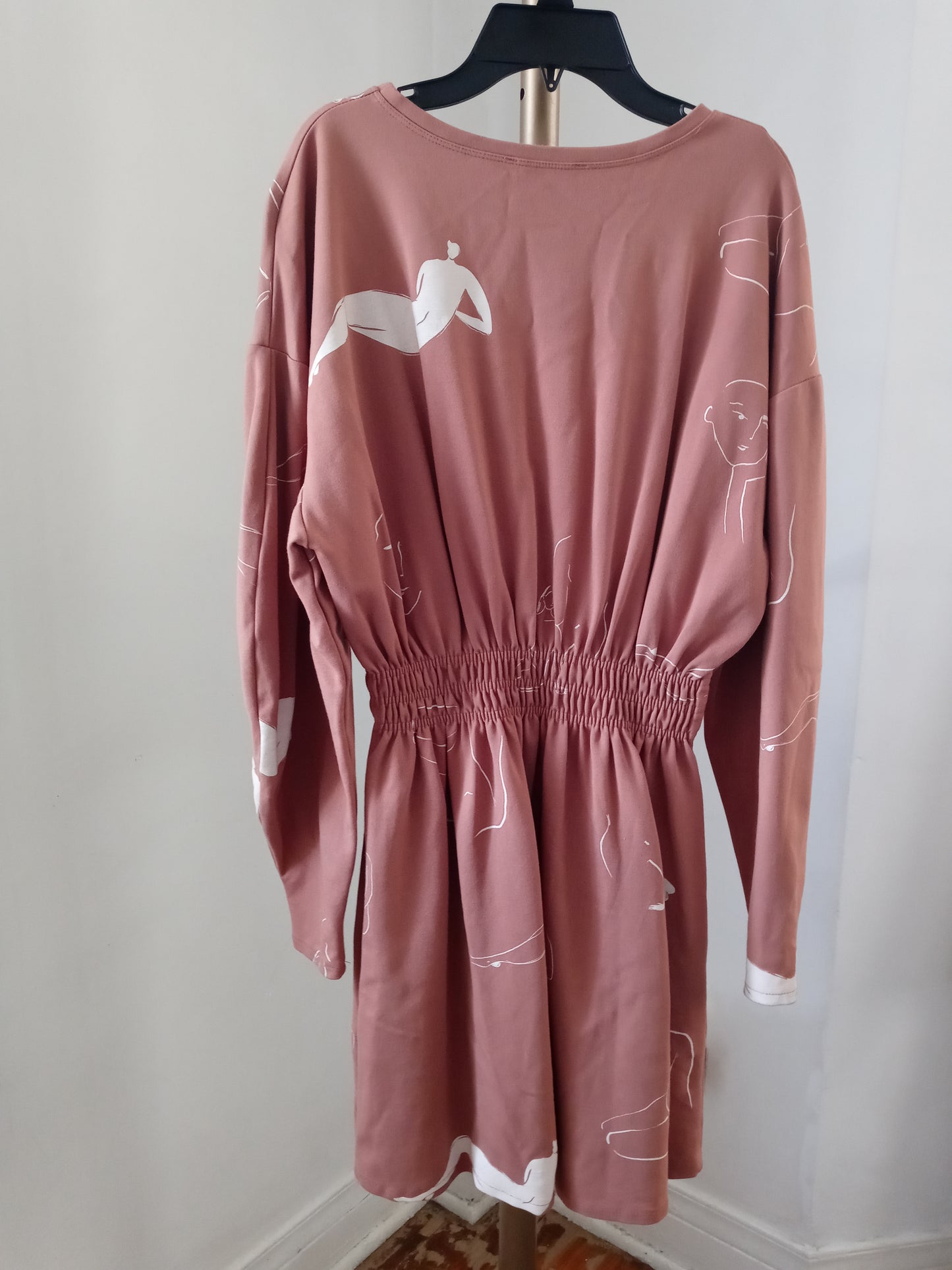 Zara dusty pink long sleeve dress with abstract line drawing of female